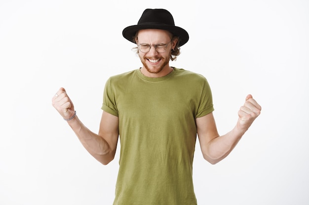 Expressive redhead bearded man with a hat