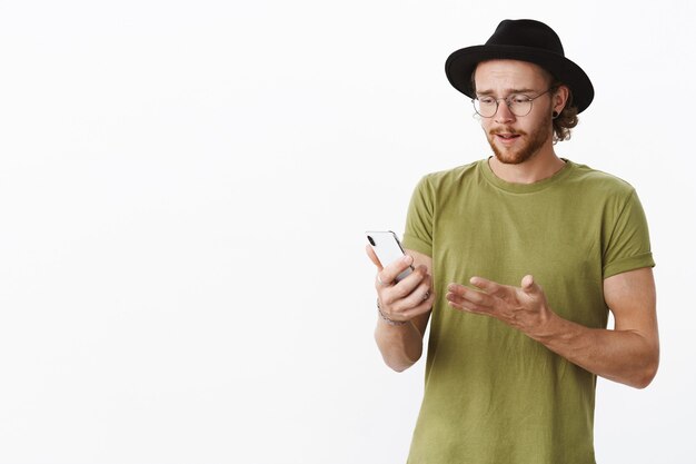 Expressive redhead bearded man with a hat