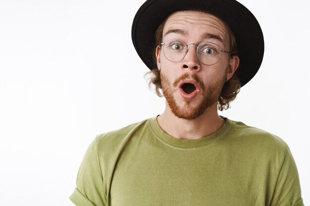 Expressive redhead bearded man with a hat