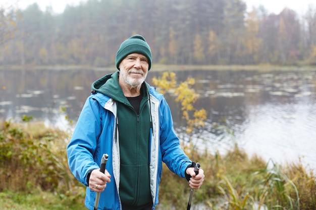 Expressive senior man posing outdoor