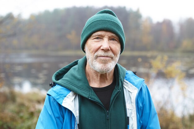 Expressive senior man posing outdoor