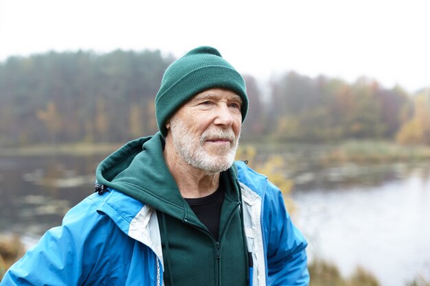 Expressive senior man posing outdoor