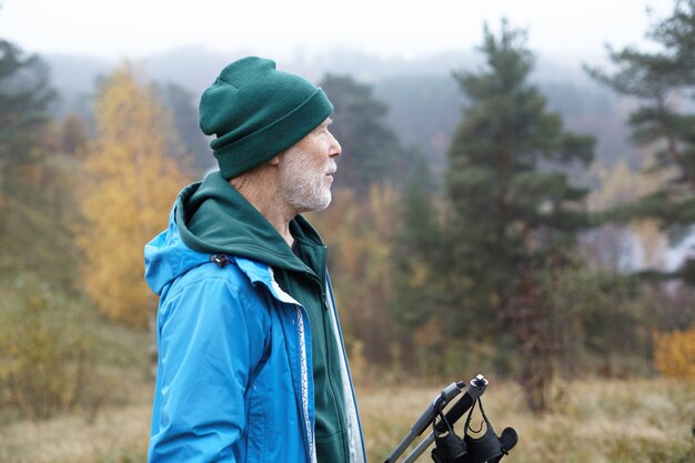 Expressive senior man posing outdoor