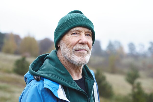 Expressive senior man posing outdoor