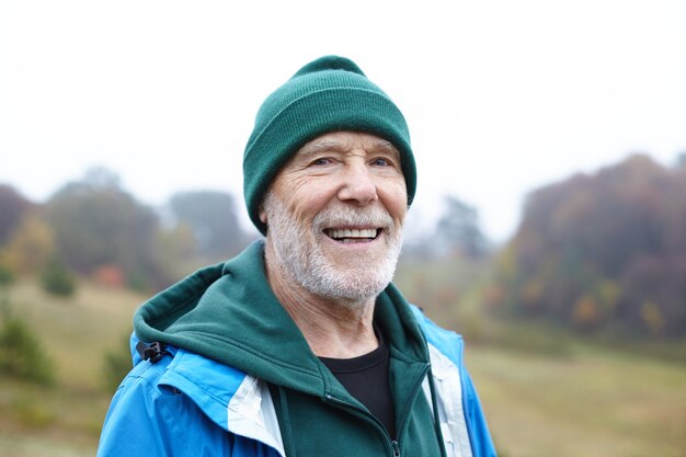 Expressive senior man posing outdoor