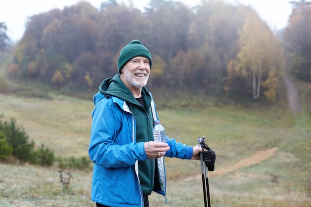 Expressive senior man posing outdoor