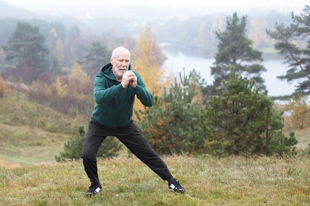 Expressive senior man posing outdoor