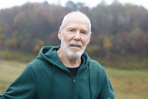 Expressive senior man posing outdoor