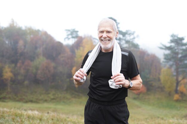 Expressive senior man posing outdoor