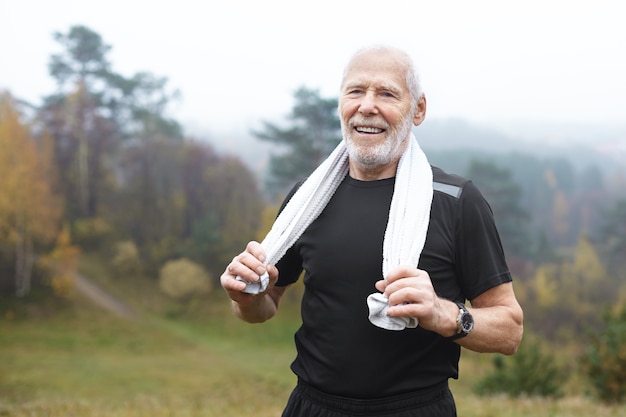 Expressive senior man posing outdoor