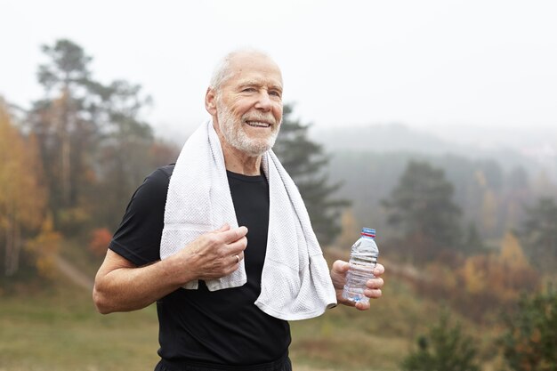 Expressive senior man posing outdoor