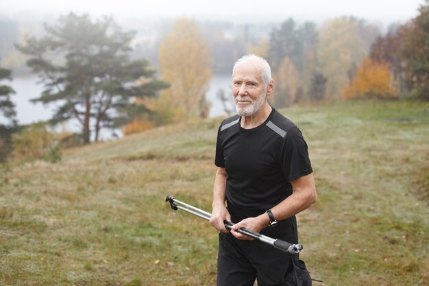 Expressive senior man posing outdoor