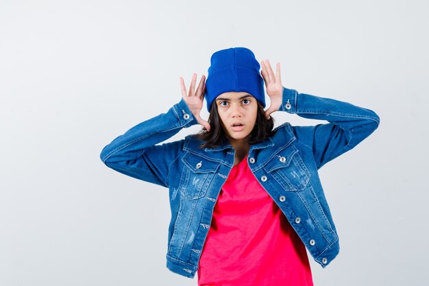 An expressive teenage girl is posing