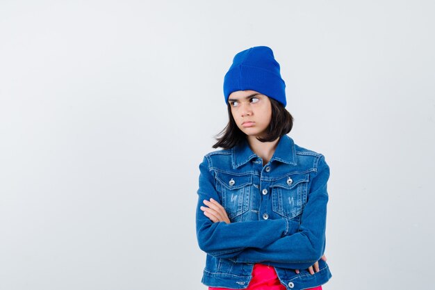 An expressive teenage girl is posing