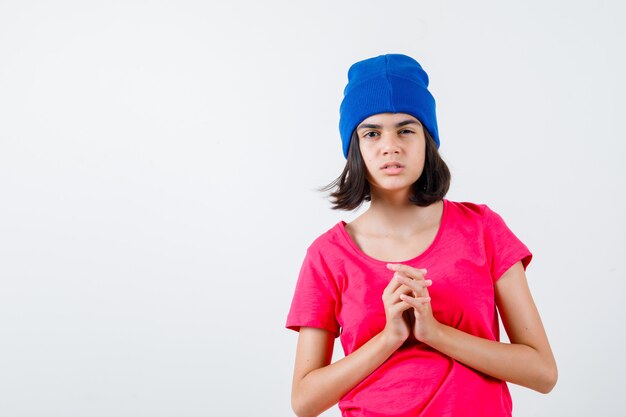 An expressive teenage girl is posing