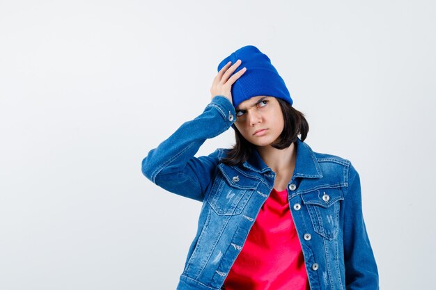 An expressive teenage girl is posing