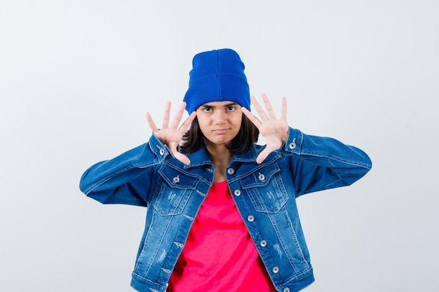 An expressive teenage girl is posing