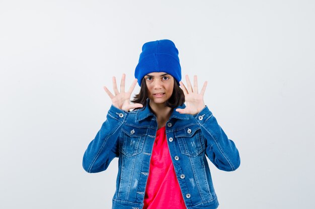 An expressive teenage girl is posing