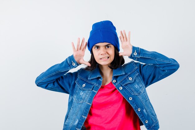 An expressive teenage girl is posing