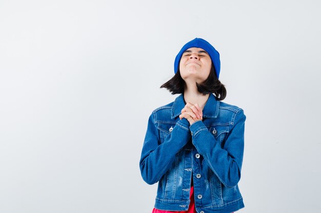 An expressive teenage girl is posing