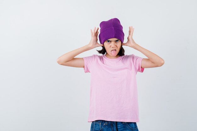 An expressive teenage girl is posing