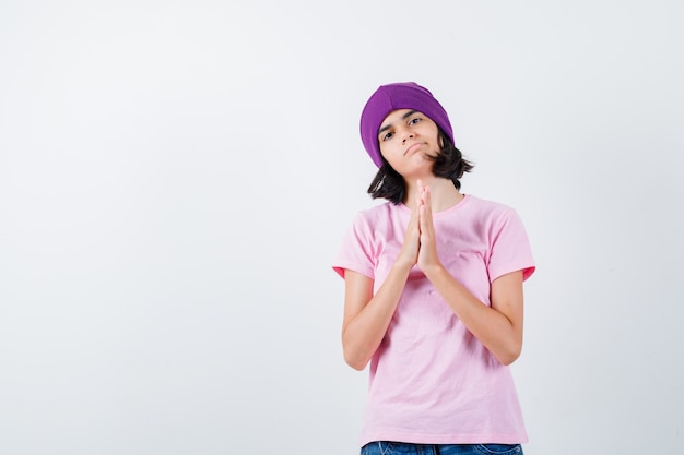 An expressive teenage girl is posing