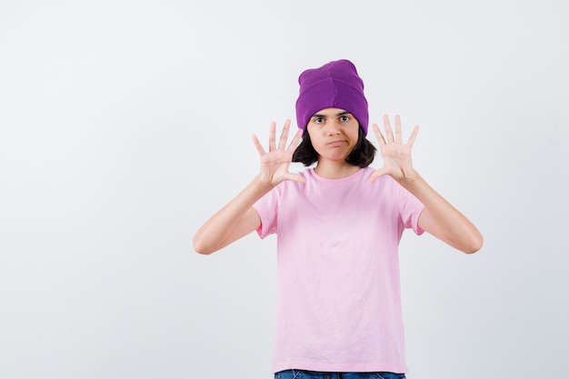 An expressive teenage girl is posing