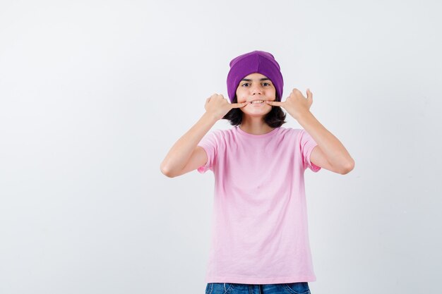 An expressive teenage girl is posing