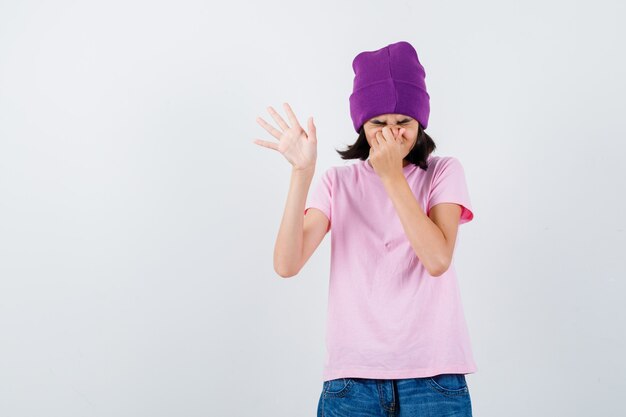 An expressive teenage girl is posing