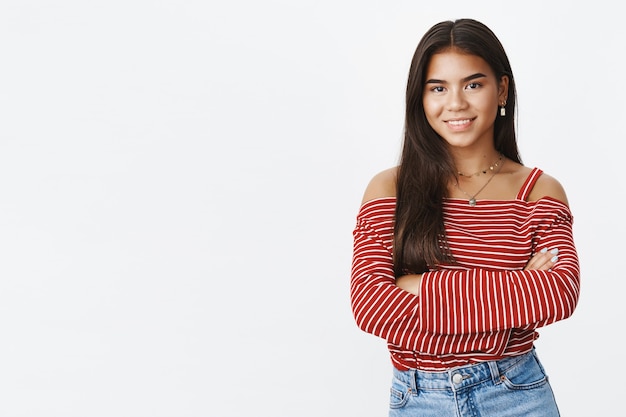 Free photo an expressive teenage girl in a striped blouse