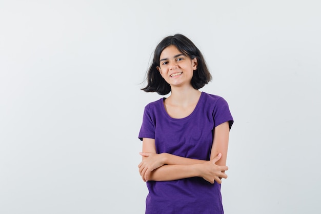 An expressive teenager is posing in the studio