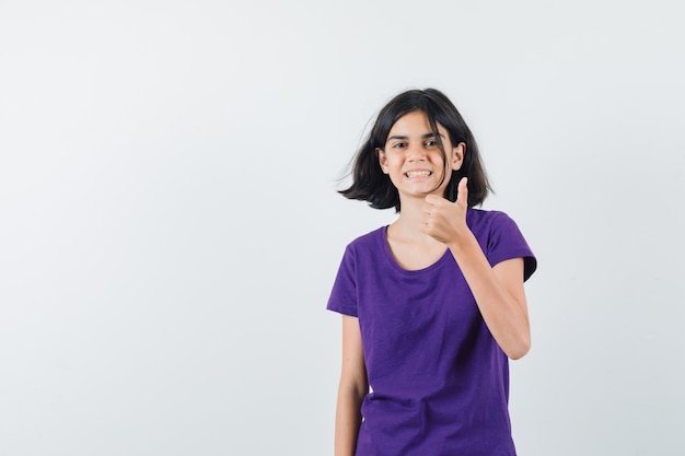 An expressive teenager is posing in the studio