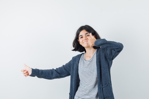 An expressive woman is posing in the studio