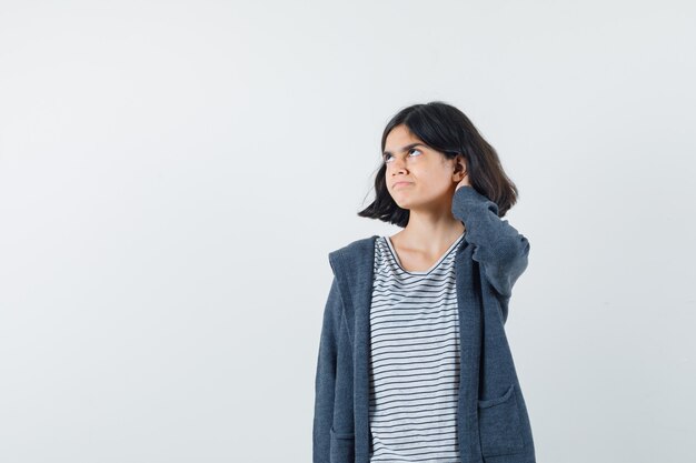 An expressive woman is posing in the studio