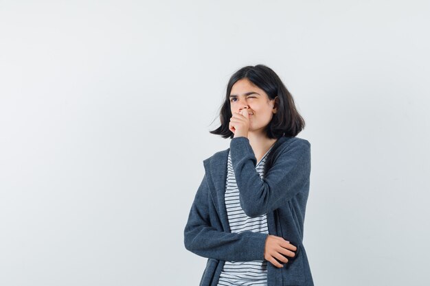 An expressive woman is posing in the studio