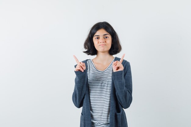 An expressive woman is posing in the studio