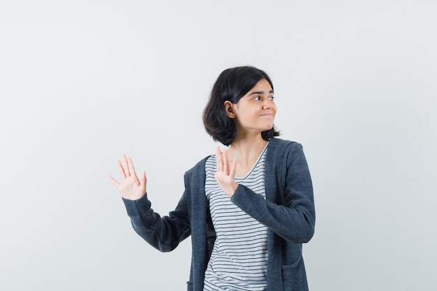 An expressive woman is posing in the studio