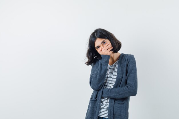 An expressive woman is posing in the studio