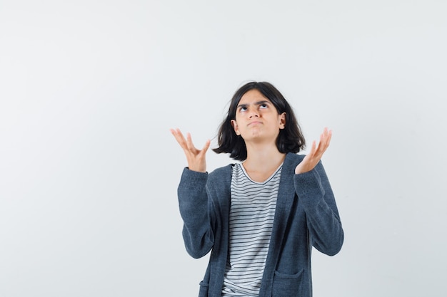 An expressive woman is posing in the studio