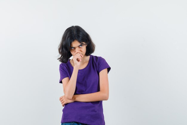 An expressive woman is posing in the studio