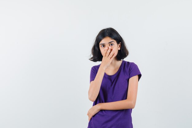 An expressive woman is posing in the studio