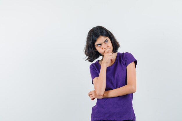 An expressive woman is posing in the studio