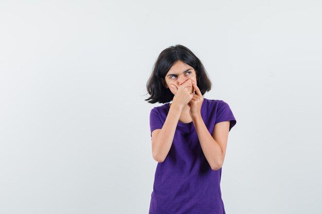 An expressive woman is posing in the studio