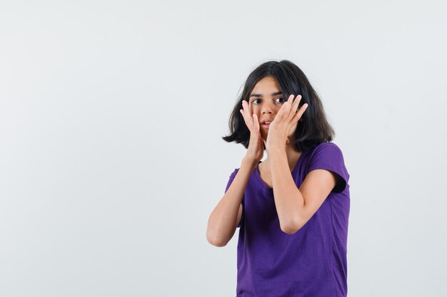 An expressive woman is posing in the studio