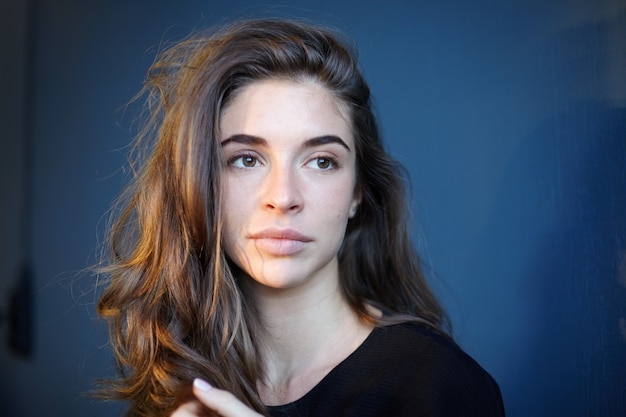 Expressive woman posing indoor