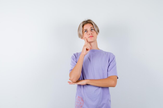 Expressive young boy posing in the studio