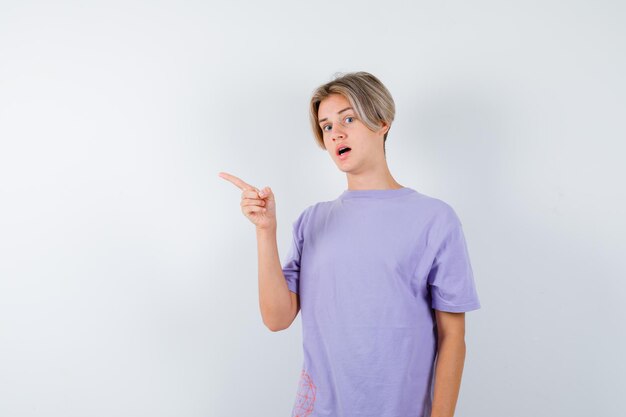 Expressive young boy posing in the studio