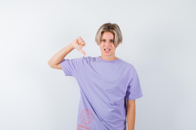 Expressive young boy posing in the studio