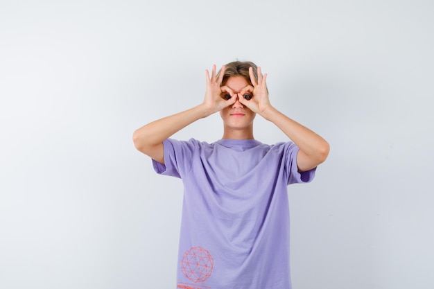 Expressive young boy posing in the studio