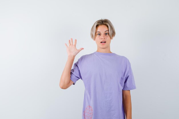 Expressive young boy posing in the studio